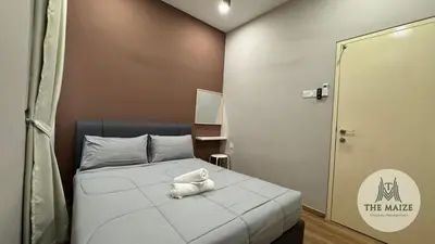 a small room with a bed with a stuffed animal on it at Verdant Sunset The Cove Ipoh in Ipoh