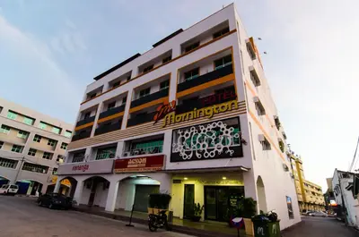 a building with a sign on the side of it at Mornington Hotel Sitiawan in Sitiawan