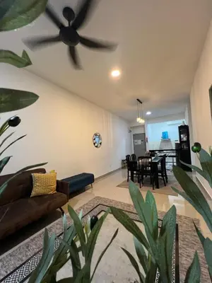 a living room with a ceiling fan and a couch at Shahiqa Homestay Cameron Highland in Brinchang