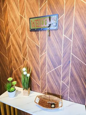 a sign on a wall above a table with a toilet at 30 Bercham Double-Storey Homestay in Ipoh