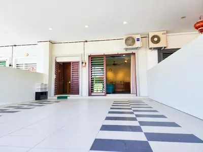 an empty room with a checkered floor in a building at 30 Bercham Double-Storey Homestay in Ipoh