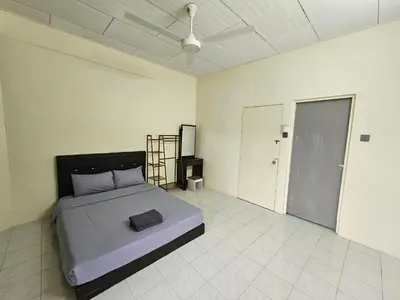 a bedroom with a bed in a room at May Flower Hostel in Ipoh