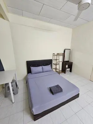 a bedroom with a bed in a room at May Flower Hostel in Ipoh