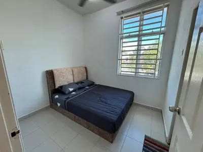 a small bedroom with a bed and a window at MDRS Seroja 6 in Kuala Ketil