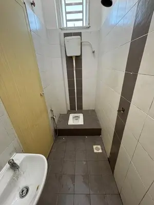 a small bathroom with a sink and a toilet at MDRS Seroja 6 in Kuala Ketil
