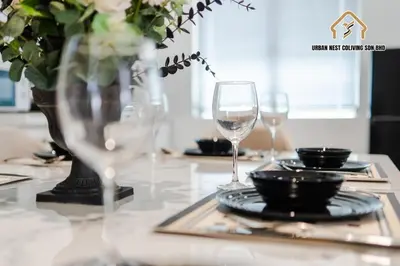 a table with two wine glasses and plates on it at Georgetown Elegant Chanel-style KTV 4BR 18Pax A in George Town