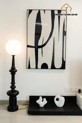 a lamp and vases on a table in front of a painting at Georgetown Elegant Chanel-style KTV 4BR 18Pax A in George Town