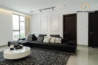 a living room with a black couch and a coffee table at Georgetown Elegant Chanel-style KTV 4BR 18Pax A in George Town