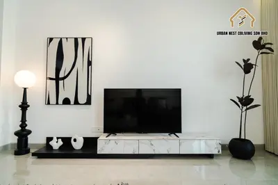 a living room with a tv on a white wall at Georgetown Elegant Chanel-style KTV 4BR 18Pax A in George Town