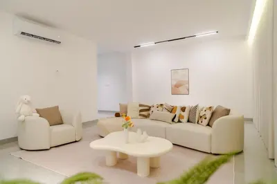 a living room with two couches and a coffee table at Georgetown Bright & Kid-Friendly KTV 3BR 15pax C in George Town