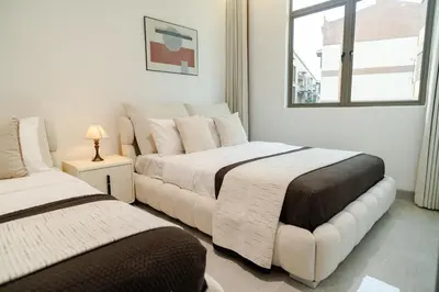 a bedroom with two beds and a window at Georgetown Bright & Kid-Friendly KTV 3BR 15pax C in George Town