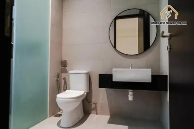 a bathroom with a white toilet and a mirror at Georgetown Stylish Design Jacuzzi KTV 5BR 16pax D in George Town
