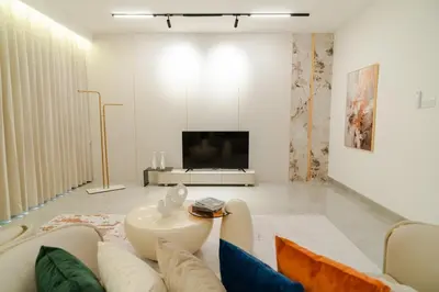 a living room with a couch and a tv at Georgetown Elegant Golden Jacuzzi KTV 5BR 16pax E in George Town