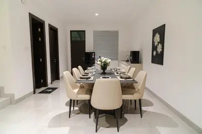 a dining room with a table and chairs at Georgetown Chanel-Style Jacuzzi & KTV 5BR 18pax F in George Town