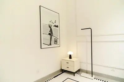 a white room with a dresser and a picture on the wall at Georgetown Chanel-Style Jacuzzi & KTV 5BR 18pax F in George Town