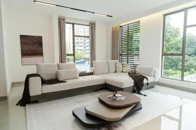a living room with a couch and a table at Georgetown Modern Brown-Colored KTV 5BR 18pax H in George Town