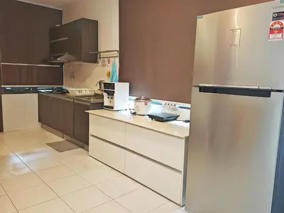 a kitchen with a stainless steel refrigerator at 2 Spacious Lupsxury conor villa garden Parking group family gathering wedding in Gelugor