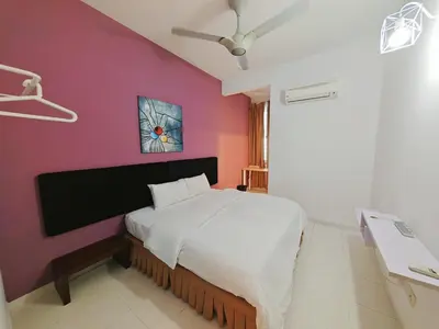 a bedroom with a bed and a purple wall at 2 Spacious Lupsxury conor villa garden Parking group family gathering wedding in Gelugor