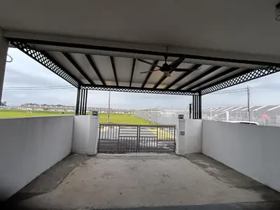 a garage with an open gate with a view of a field at Aleesa Homestay in Tapah
