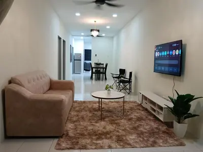 a living room with a couch and a table at Aleesa Homestay in Tapah
