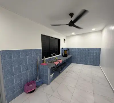 a bathroom with a sink and a tv on the wall at raub homesty in Raub