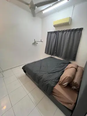 a bed in a room with a window at Raub homesty in Raub