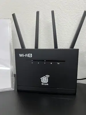 a black router sitting on top of a table at Raub homesty in Raub