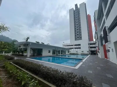 a building with a swimming pool in front of a building at The Anderson Ipoh AA4 7pax, Smart TV & Wi-Fi in Ipoh
