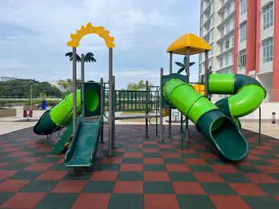 a playground with a green slide on a checkered floor at The Anderson Ipoh AA4 7pax, Smart TV & Wi-Fi in Ipoh
