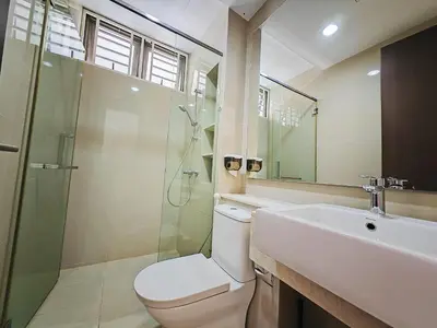 a bathroom with a toilet and a sink and a shower at 142 spacious 3storey 6BR 6bath for big family wedding birthday easy parking in Gelugor