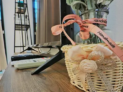 a basket with a vase of flowers on a table at 142 spacious 3storey 6BR 6bath for big family wedding birthday easy parking in Gelugor