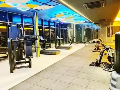 a gym with treadmills and elliptical machines at Taste of Home in Ipoh