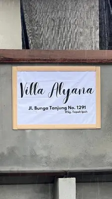 a sign on the side of a building at Villa Alyana in Ipoh