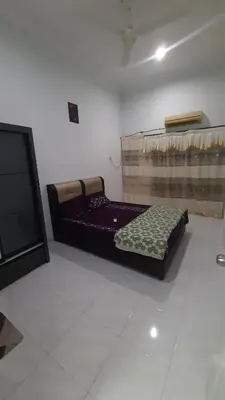a bed sitting in a room with at Glory Homestay Ipoh in Ipoh
