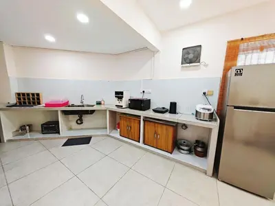 a kitchen with a counter and a refrigerator at 45GeorgeTown Multi Family corner lot free parking food convenience stores nearby in George Town