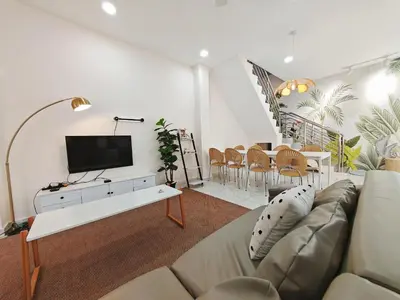 a living room with a couch and a tv at 45GeorgeTown Multi Family corner lot free parking food convenience stores nearby in George Town