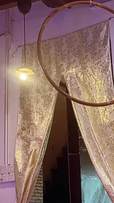 a curtain on a window with a light at Heritage House 123 in George Town