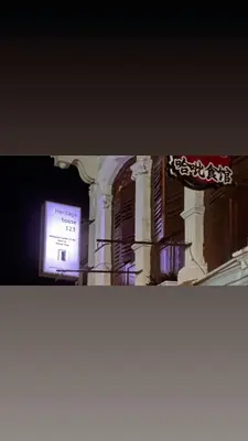 a sign on the side of a building at night at Heritage House 123 in George Town