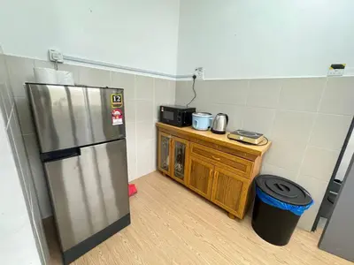 a kitchen with a stainless steel refrigerator and a counter at Eisya Homestay 2 at Emerald Avenue Brinchang in Brinchang
