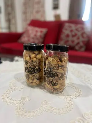 two jars of food are sitting on a table at Villa Alyana in Ipoh