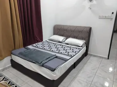 a bed sitting in a room with at Tasmie homestay in Butterworth