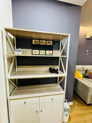 a white book shelf with shoes in a room at Perfect for Groups! 5BR Villa Near Beach BBQ 20Pax in Batu Ferringhi