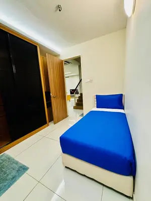a bedroom with a blue bed in a room at Perfect for Groups! 5BR Villa Near Beach BBQ 20Pax in Batu Ferringhi