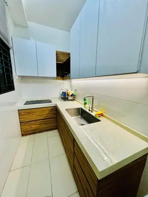 a kitchen with a sink and blue cabinets at Perfect for Groups! 5BR Villa Near Beach BBQ 20Pax in Batu Ferringhi