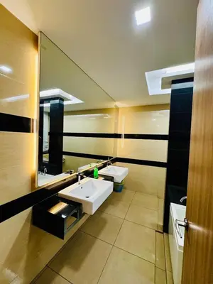 a bathroom with two sinks and a large mirror at Perfect for Groups! 5BR Villa Near Beach BBQ 20Pax in Batu Ferringhi