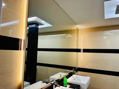 a bathroom with two sinks and a large mirror at Perfect for Groups! 5BR Villa Near Beach BBQ 20Pax in Batu Ferringhi