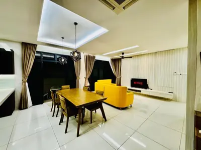 a living room with a dining table and yellow chairs at Opulent Villa for 20pax BBQ, Steps to Beach Market in Batu Ferringhi