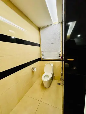 a bathroom with a toilet in a room at Elegant20PaxVilla Perfect Location NearBeachMarket in Batu Ferringhi