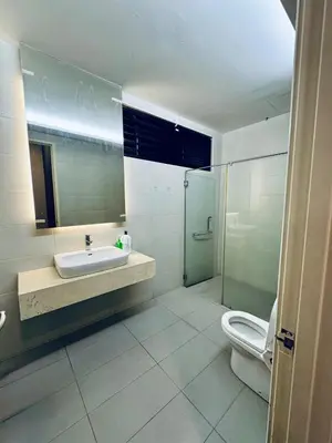 a bathroom with a sink and a shower and a toilet at Charming Luxury Villa 20,BBQ, Close to Beach Shops in Batu Ferringhi
