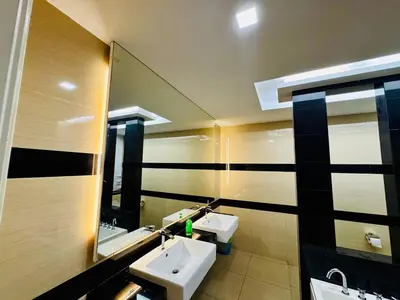 a bathroom with two sinks and a mirror at Beautiful 20-Person Villa, Walk to Beach & Market in Batu Ferringhi